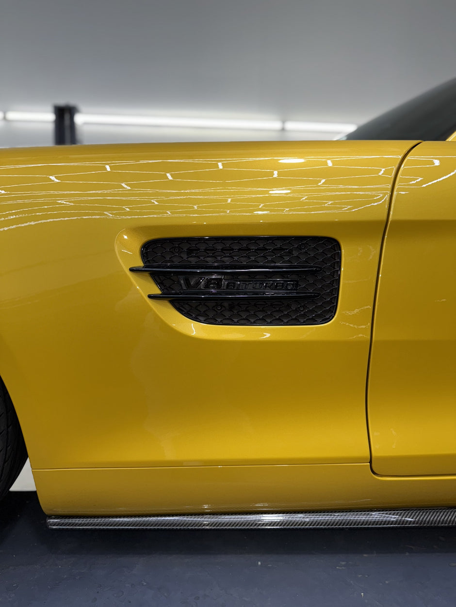 Close-up of a yellow AMG fender 