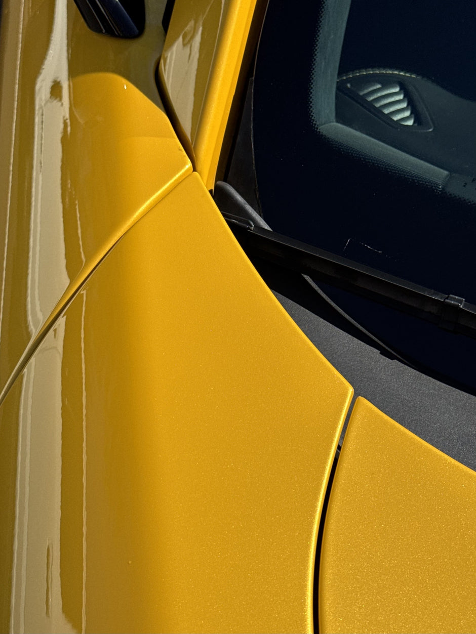 Close-up of a yellow AMG GT