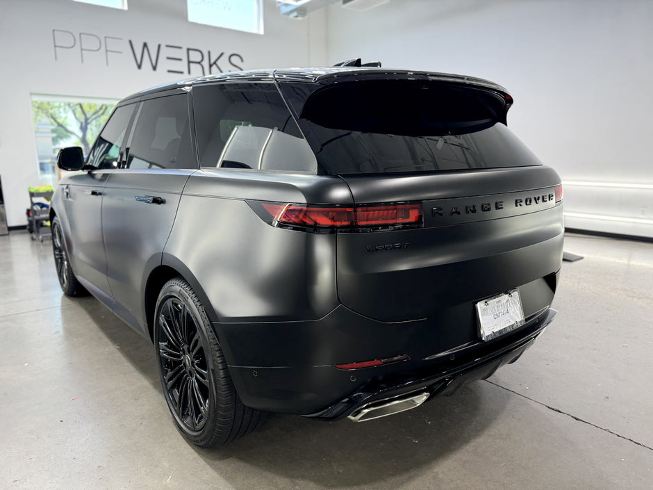 Matte Black Range Rover in a showroom with 'PPF Werks' branding.