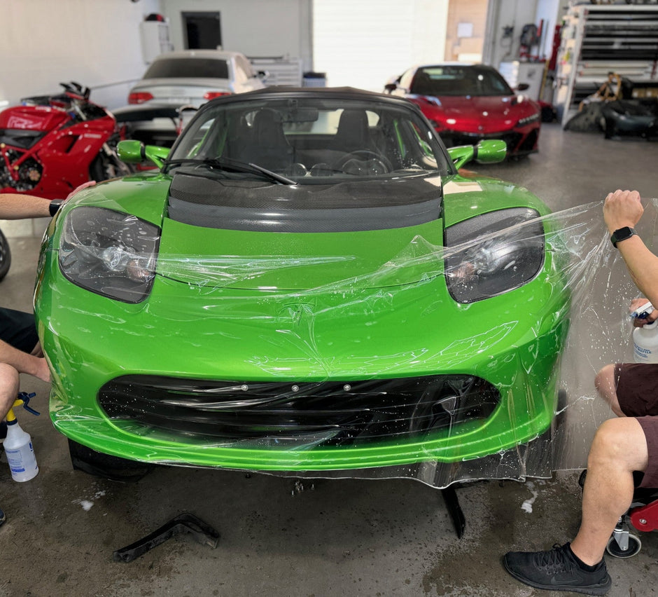 PPF installers installing PPF on Green roadster 