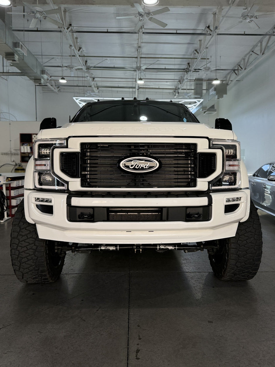 White Ford truck in a warehouse setting